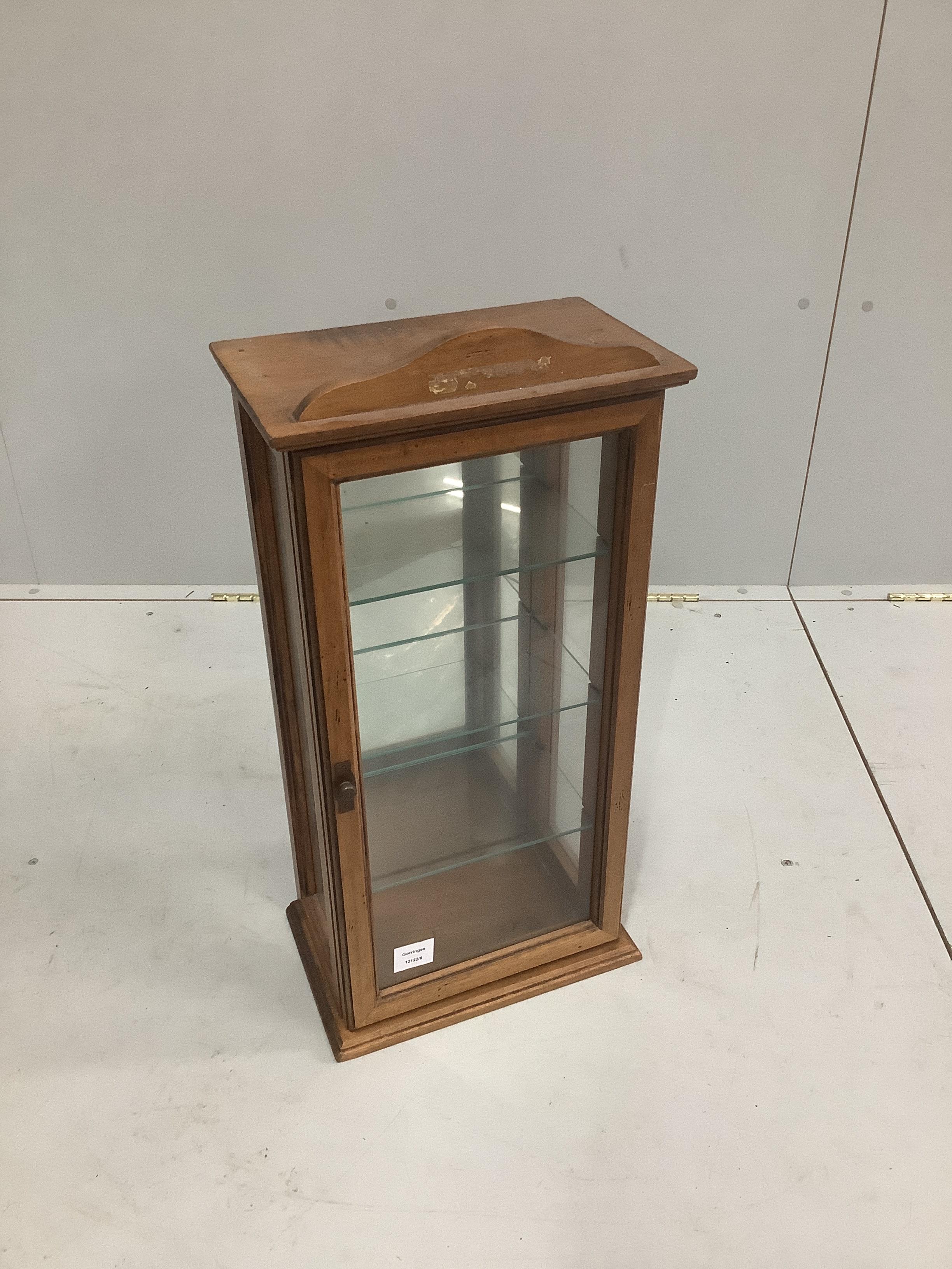 An Edwardian glazed beech shop display cabinet, width 34cm, height 69cm